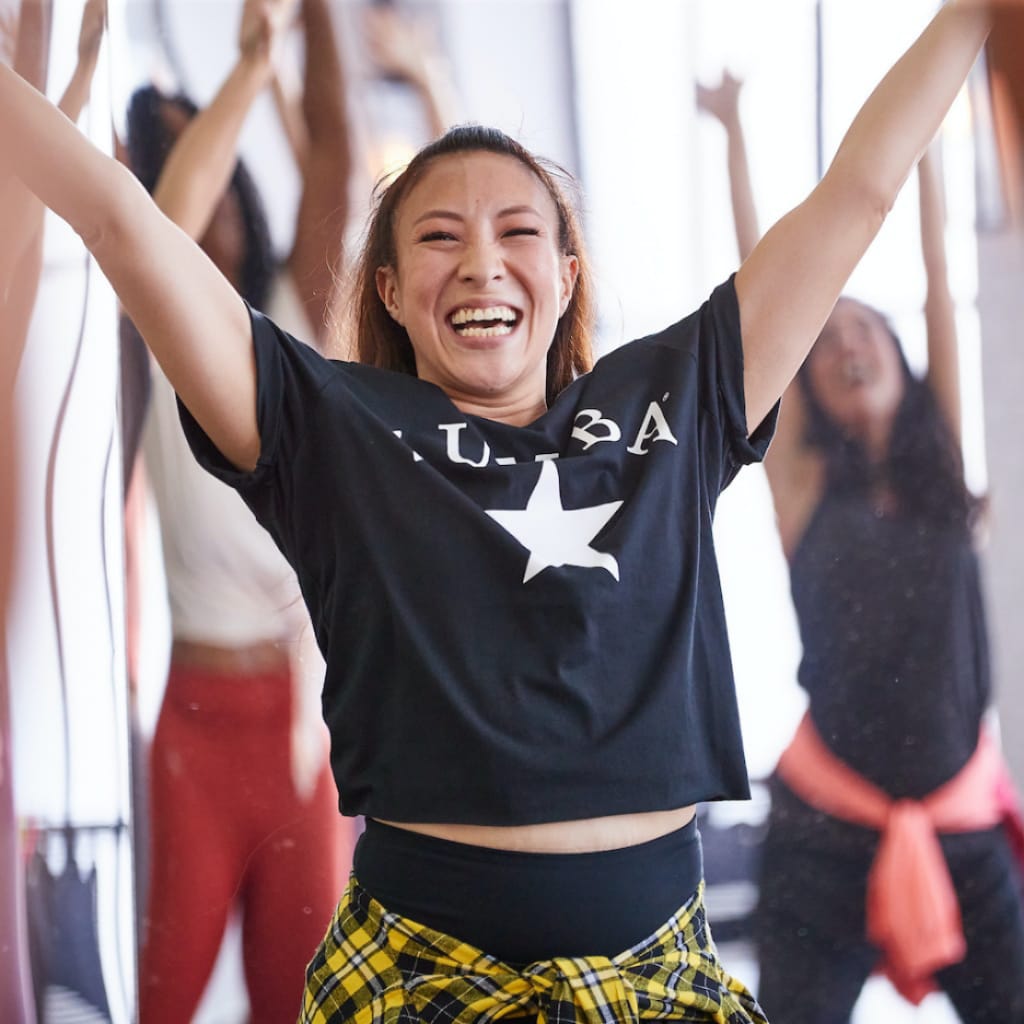 Woman dancing zumba with a starry T-shirt