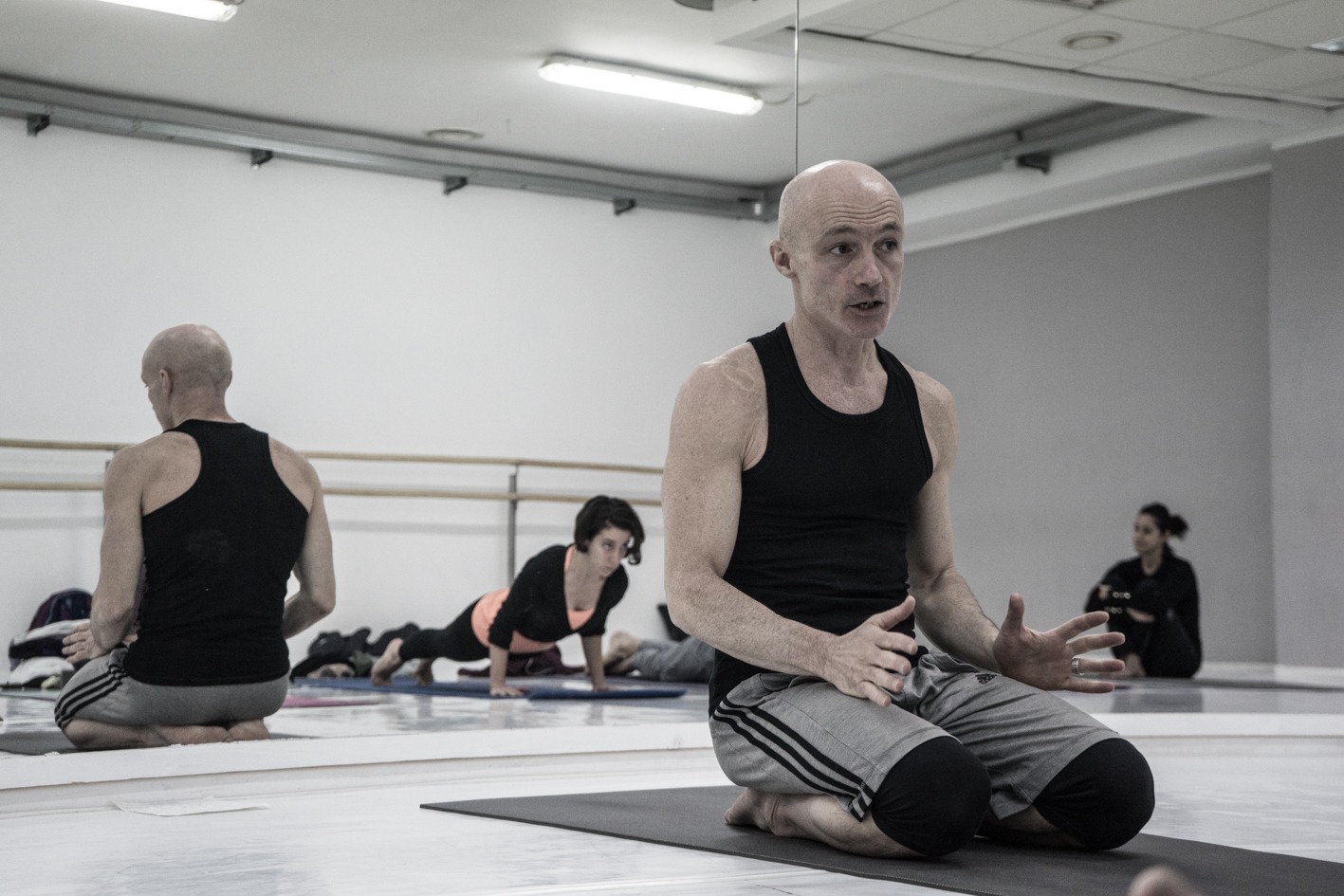 1 Daniele Morganti's Ashtanga workshop in Barcelona, November 2023, sitting on a yoga mat.