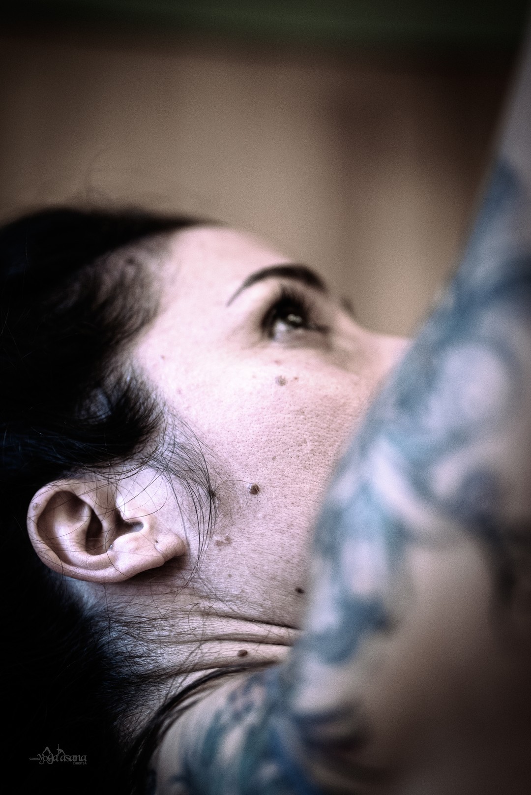 A close up of a woman with tattoos on her arm.